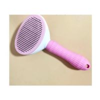 Cepillo con extractor de pelos para perros y gatos color rosado