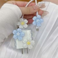 CASE PROTECTOR DE CARGADOR DE IPHONE DE FLORES HAWAIANAS CELESTE