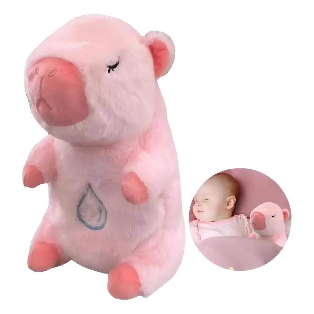 PELUCHE FELPA FORMA CAPIBARA MUSICAL COLOR ROSADO.
