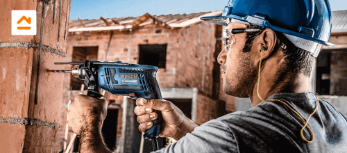 persona-taladrando-pared